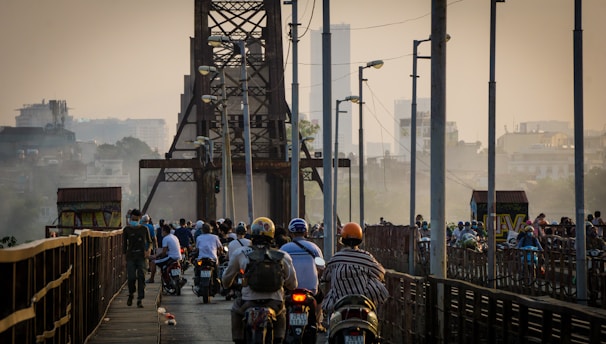 American flag against a backdrop of city buildings